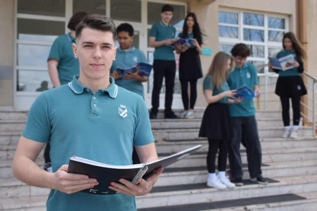 rps student holding a book rps student holding a book